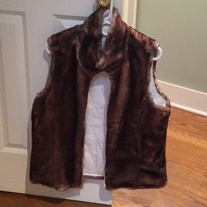Fabulous faux fur reversible zippered vest .